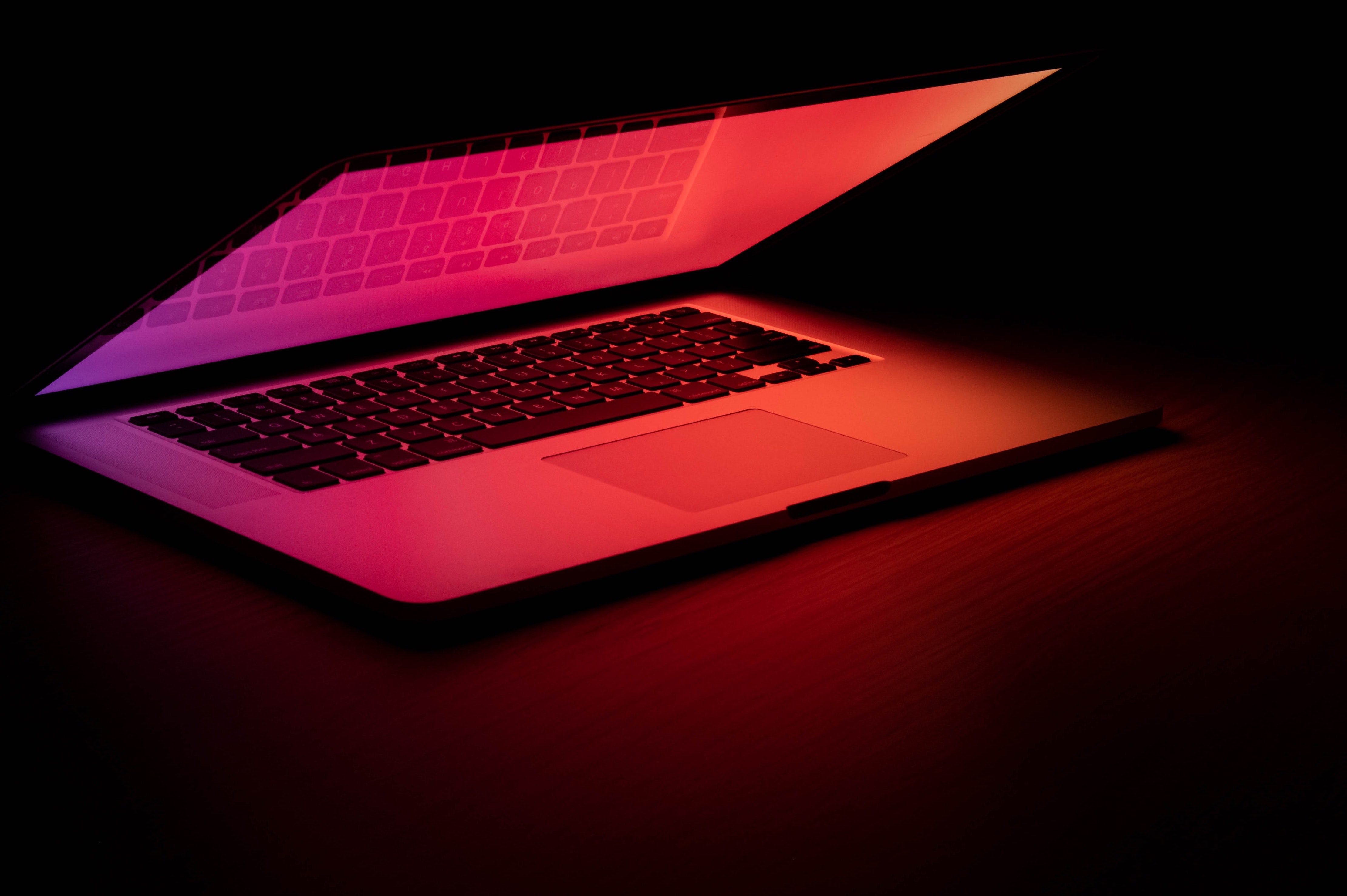 A laptop with a glowing red screen.