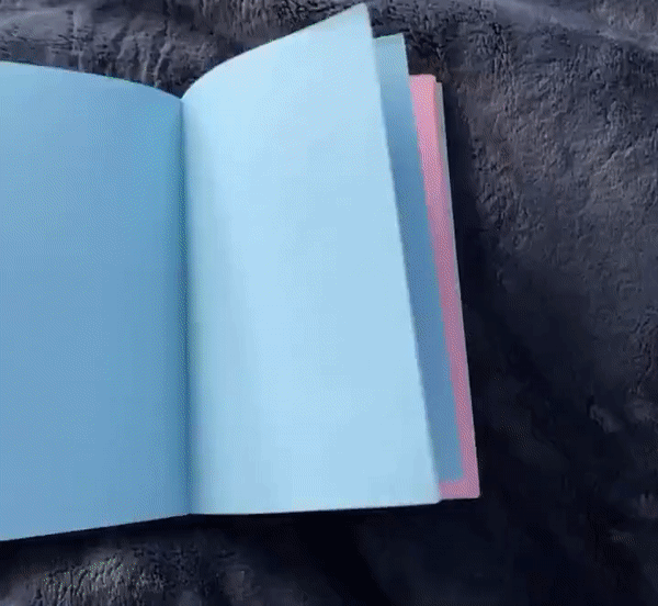 a Gif of a rainbow notebook that I binded being flipped through